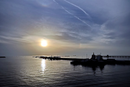 Sunset over the sea and the pier in Odessa, Ukraineの写真素材
