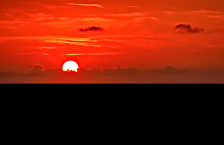 Beautiful sunset over the sea. Colorful dramatic sky with cloud at sunset.の写真素材