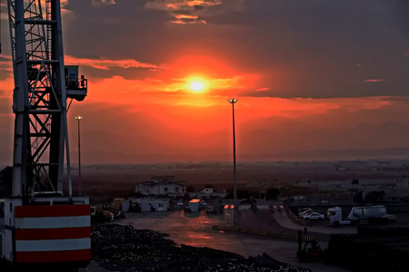 Sunset in the port of Barcelona, Spain. The port of Barcelona is under construction.の写真素材