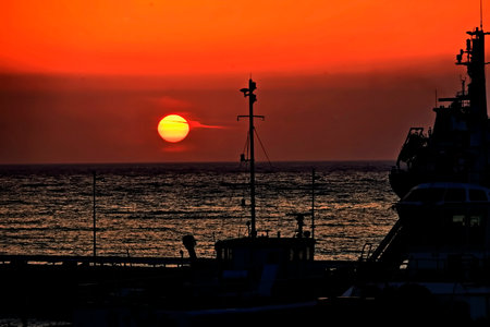 Sunset on the Mediterranean Sea with ships in the background, Spainの写真素材
