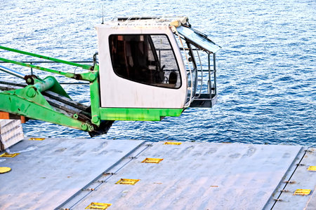 Cargo ship in the sea, close-up of the crane