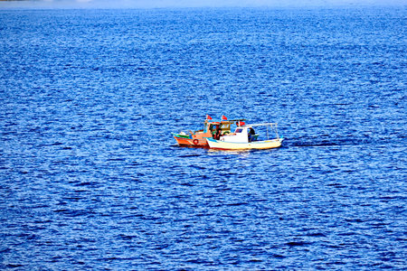 Fishing boat on the blue sea. Fishing boat in the sea.の写真素材