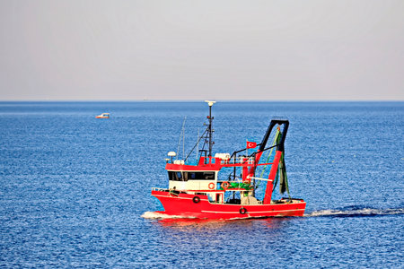 Fishing trawler in the sea, closeup of photoの写真素材