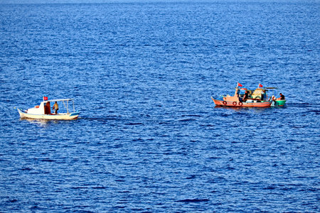 Fishing boats in the seaの写真素材