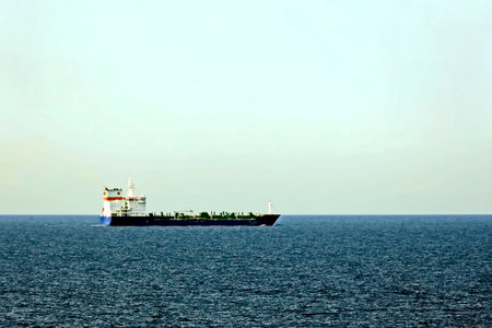 Large cargo ship sailing in the open sea, closeup of photoの写真素材