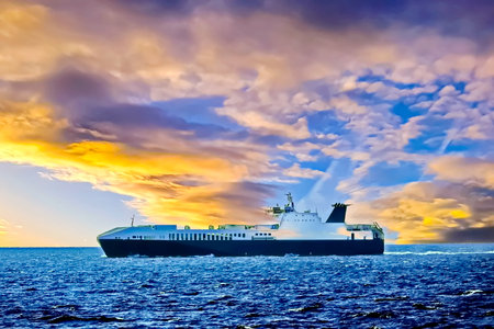 Cargo ship in the sea at sunset. Transportation and logistics background
