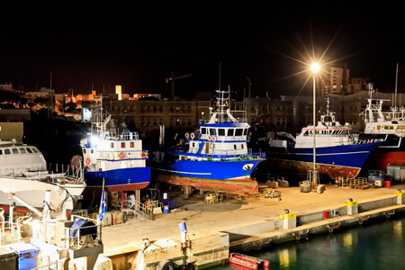Fishing boats moored in the port of Marsaxlokk, Maltaの写真素材