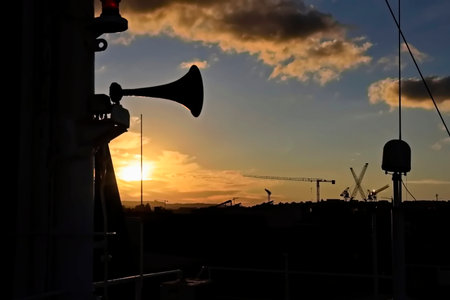 Silhouette of a trumpet on the background of the setting sunの写真素材
