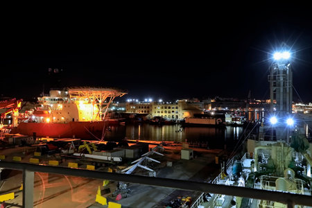 Cargo ship in the port at night, Odessa, Ukraineの写真素材