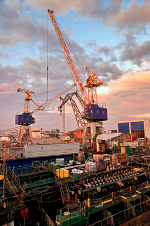 Container terminal with cranes at sunset, Odessa, Ukraine.の写真素材