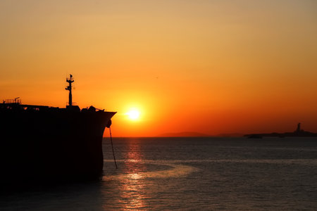 Silhouette of a ship at sunset in Ibiza, Spainの写真素材