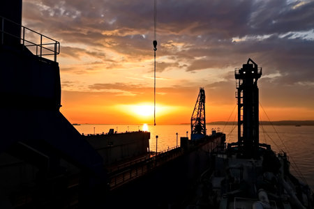 Ship in the sea at sunset.