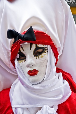 Red and white mask in Venice, Italy.の写真素材