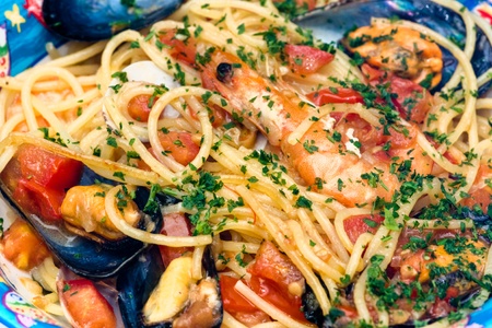 Spaghetti with Shrimp, clam, mussel and fresh tomatoの写真素材