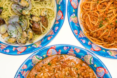 Tris of Italian Pasta and Rice. ( Spaghetti with Clams, Spaghetti with mix seafood, Rice with Squid.)の写真素材