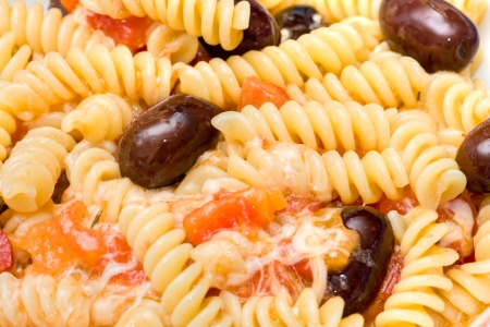 Italian Pasta with cheese, fresh tomatoes and olives  の写真素材