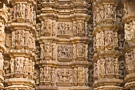 Kama sutra scene on the wall of a Temple in Khajuraho. Madhya Pradesh, India.の写真素材