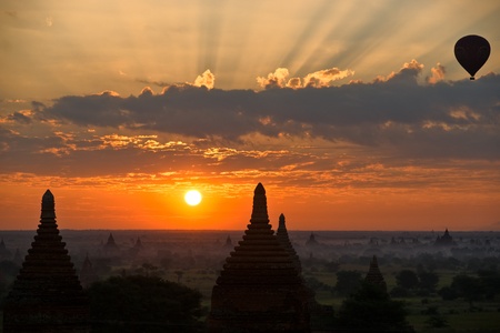  Silhouette of Buddhist Pagodas at sunrise with Hot Air Balloon, Plain of Bagan, Myanmar.の写真素材