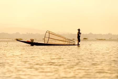 Silhouette of Fisherman in inle lake, Myanmar.の写真素材
