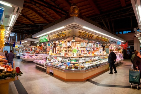 BARCELONA, SPAIN - DECEMBER 20: Tourists shop in famous La Boqueria market on December 20, 2011 in Barcelona, Spain. One of the oldest markets in Europe that still exist. Established 1217.のeditorial素材