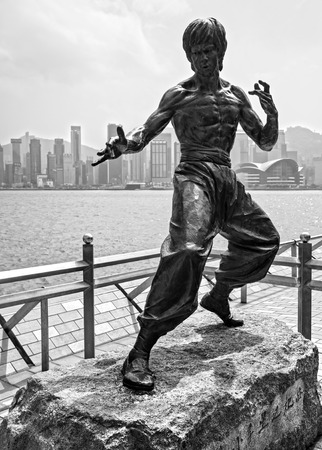 HONG KONG - MARCH 15: Bruce Lee statue on the Avenue of Stars on March 15, 2013 in Tsim Sha Tsui, Hong Kong. The statue is one of the main attractions on the famous waterfront promenade.のeditorial素材