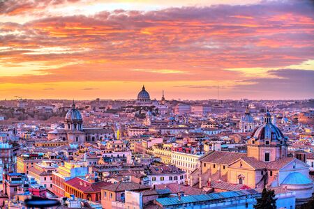Wonderful view of Rome skyline at sunset time with St Peter Cathedralの写真素材
