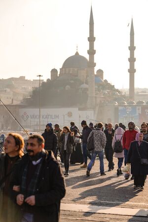 ISTANBUL, TURKEY - DECEMBER 28, 2018: People fishing at Galata Bridge in a sunny day, Beyoglu, Istanbul, Turkey.のeditorial素材