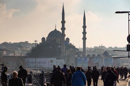 ISTANBUL, TURKEY - DECEMBER 28, 2018: People fishing at Galata Bridge in a sunny day, Beyoglu, Istanbul, Turkey.のeditorial素材
