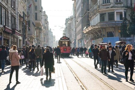 ISTANBUL, TURKEY - DECEMBER 28, 2018: Peoples walking in Taksim Istiklal Street. Taksim Istiklal Street is a popular destination in Istanbul. Beyoglu, Taksim, Istanbul. Turkey.のeditorial素材