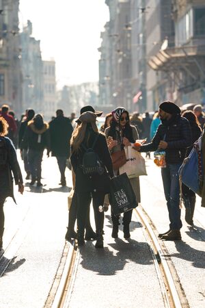 ISTANBUL, TURKEY - DECEMBER 28, 2018: Peoples walking in Taksim Istiklal Street. Taksim Istiklal Street is a popular destination in Istanbul. Beyoglu, Taksim, Istanbul. Turkey.のeditorial素材