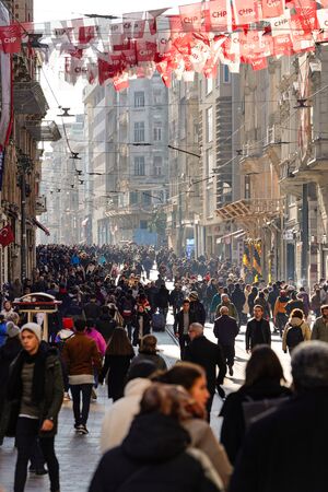 ISTANBUL, TURKEY - DECEMBER 28, 2018: Peoples walking in Taksim Istiklal Street. Taksim Istiklal Street is a popular destination in Istanbul. Beyoglu, Taksim, Istanbul. Turkey.のeditorial素材