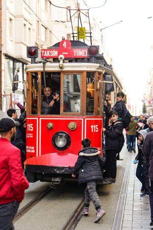 ISTANBUL, TURKEY - DECEMBER 28, 2018: Peoples walking in Taksim Istiklal Street. Taksim Istiklal Street is a popular destination in Istanbul. Beyoglu, Taksim, Istanbul. Turkey.のeditorial素材