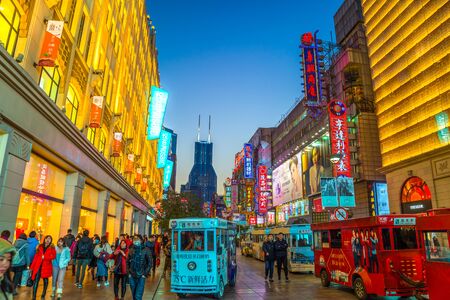 SHANGHAI, CHINA - FEBRUARY 13, 2018: Neon signs lit on Nanjing Road. The area is the main shopping district of Shanghai and one of the world's busiest shopping streets.のeditorial素材