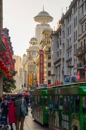 SHANGHAI, CHINA - FEBRUARY 13, 2018: Neon signs lit on Nanjing Road. The area is the main shopping district of Shanghai and one of the world's busiest shopping streets.のeditorial素材