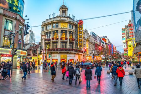 SHANGHAI, CHINA - FEBRUARY 13, 2018: Neon signs lit on Nanjing Road. The area is the main shopping district of Shanghai and one of the world's busiest shopping streets.のeditorial素材