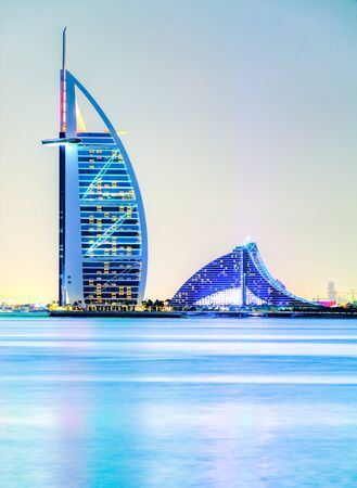 DUBAI, UAE - FEBRUARY 09, 2014: The iconics Burj al Arab and the Jumeirah Bach Hotel, Dubai, United Arab Emirates. The Burj al Arab is the first seven star hotel in the world.のeditorial素材