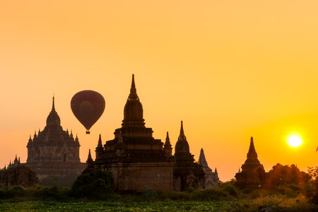 The Temple of Bagan at sunset with hot air balloon, Mandalay province, Myanmar,の写真素材