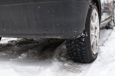 Lower part of a car on the snowの写真素材