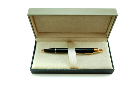 classic gold black pen in a box isolate on white backgroundの写真素材