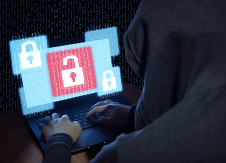 Thief are stealing data and information form labtop that is unlocked file by hacker with alnalog number background,Security cyber concept.の写真素材