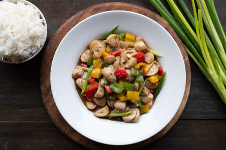 Vegan asian food mix vegetable fried include red yellow and green sweet pepper with onion and meat substitute mushroom for protiene.Top view photo vegetarian concept.の写真素材