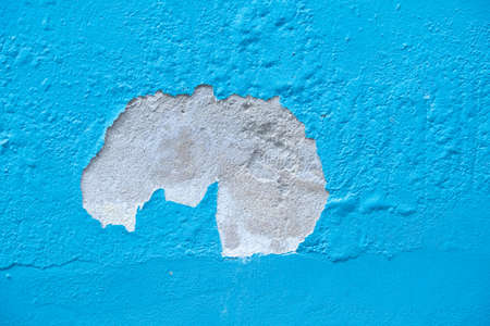 the house paint cracked on the blue wall.の写真素材