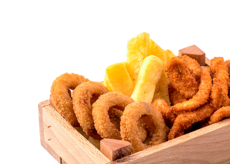 fries and chicken nugget different shapes in a wooden box on a white backgroundの写真素材