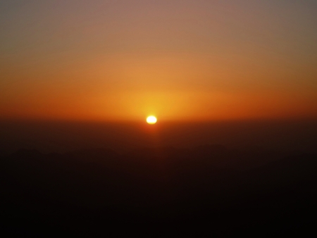 sunset on horizon and valleysの写真素材