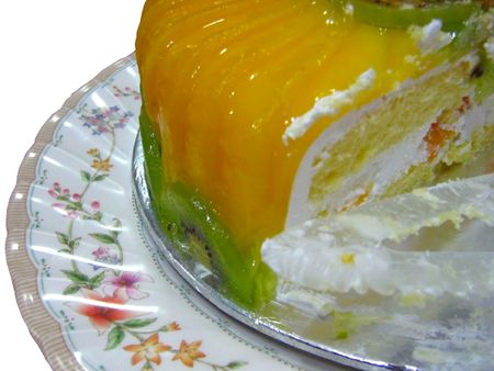 delicious cream fruit cake on white closeupの写真素材