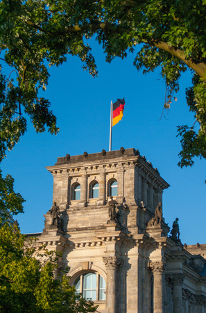 German flag on Reichstag in green leaf frameの写真素材