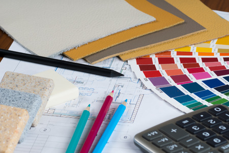 interior project with colorfull palette, material samples, pencils and calculator