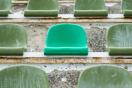 green seats in old opened stadiumの写真素材