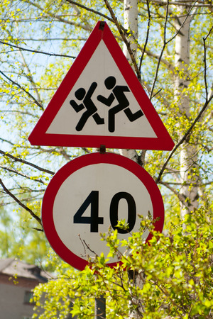 road signs speed limit and danger kidsの写真素材