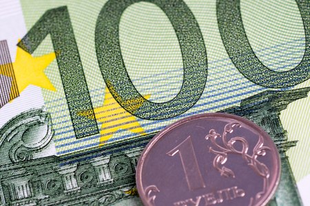 1 russian ruble coin on 100 euro banknoteの写真素材